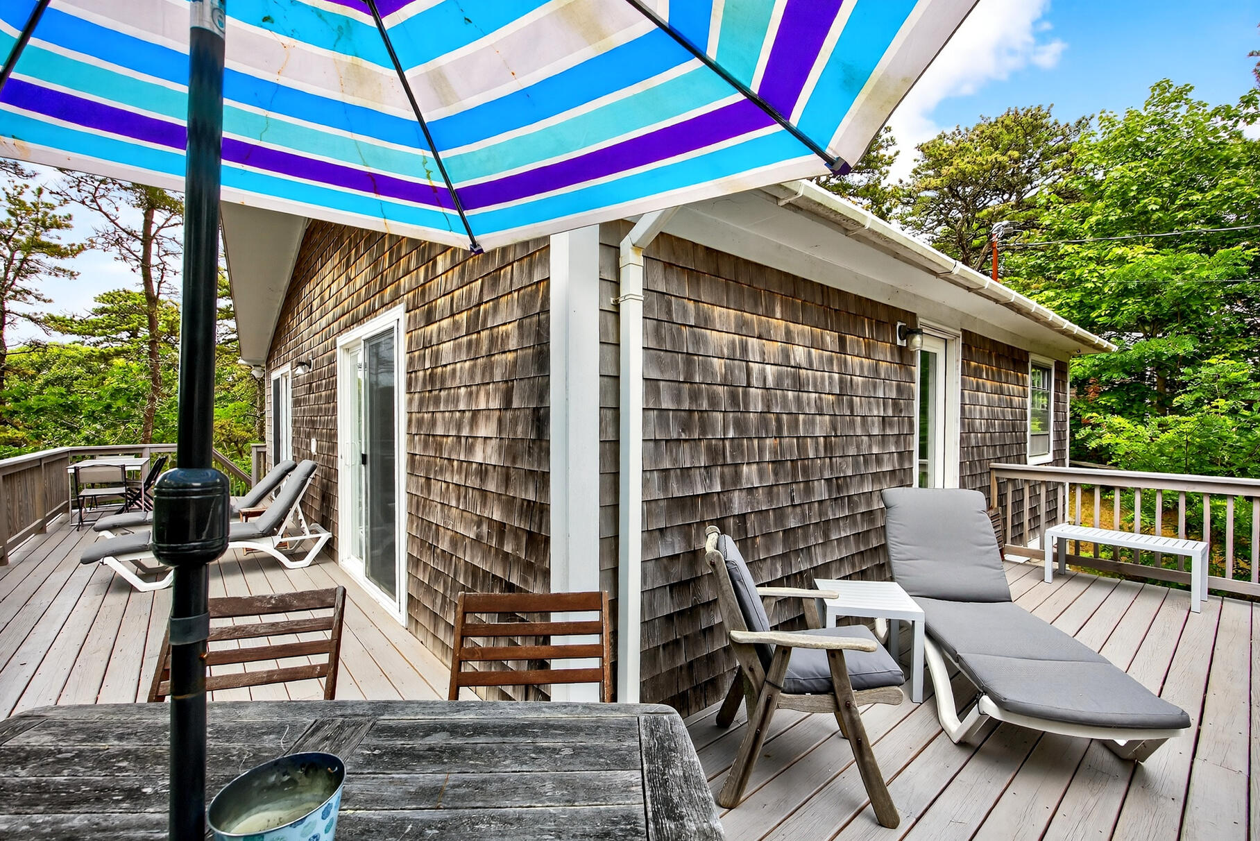46 Hiram Hill Road Wellfleet, MA 02667 - Photo 22 of 36 a view of a patio with a table and chairs