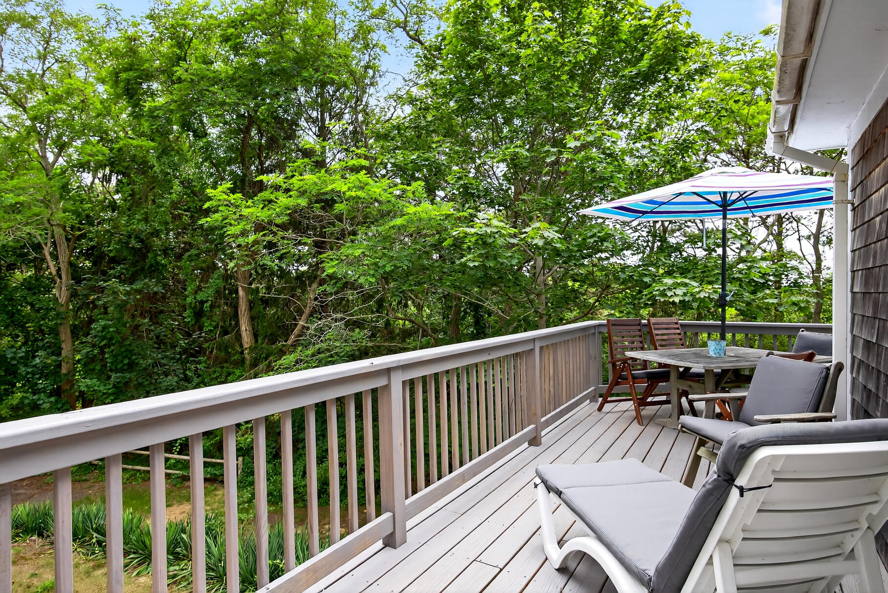 46 Hiram Hill Road Wellfleet, MA 02667 - Photo 23 of 36 a view of balcony with furniture and umbrella