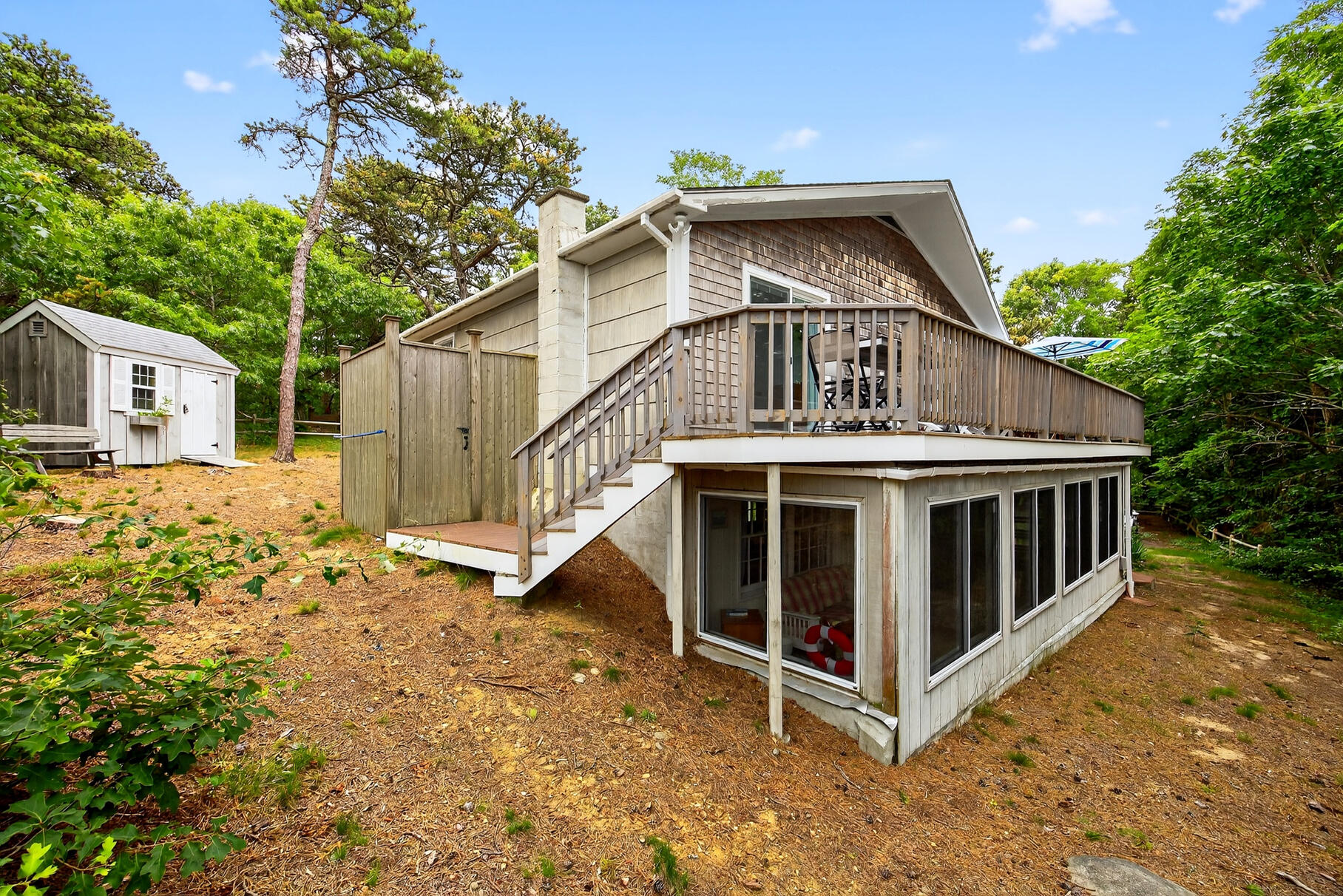 46 Hiram Hill Road Wellfleet, MA 02667 - Photo 26 of 36 a view of a house with a yard