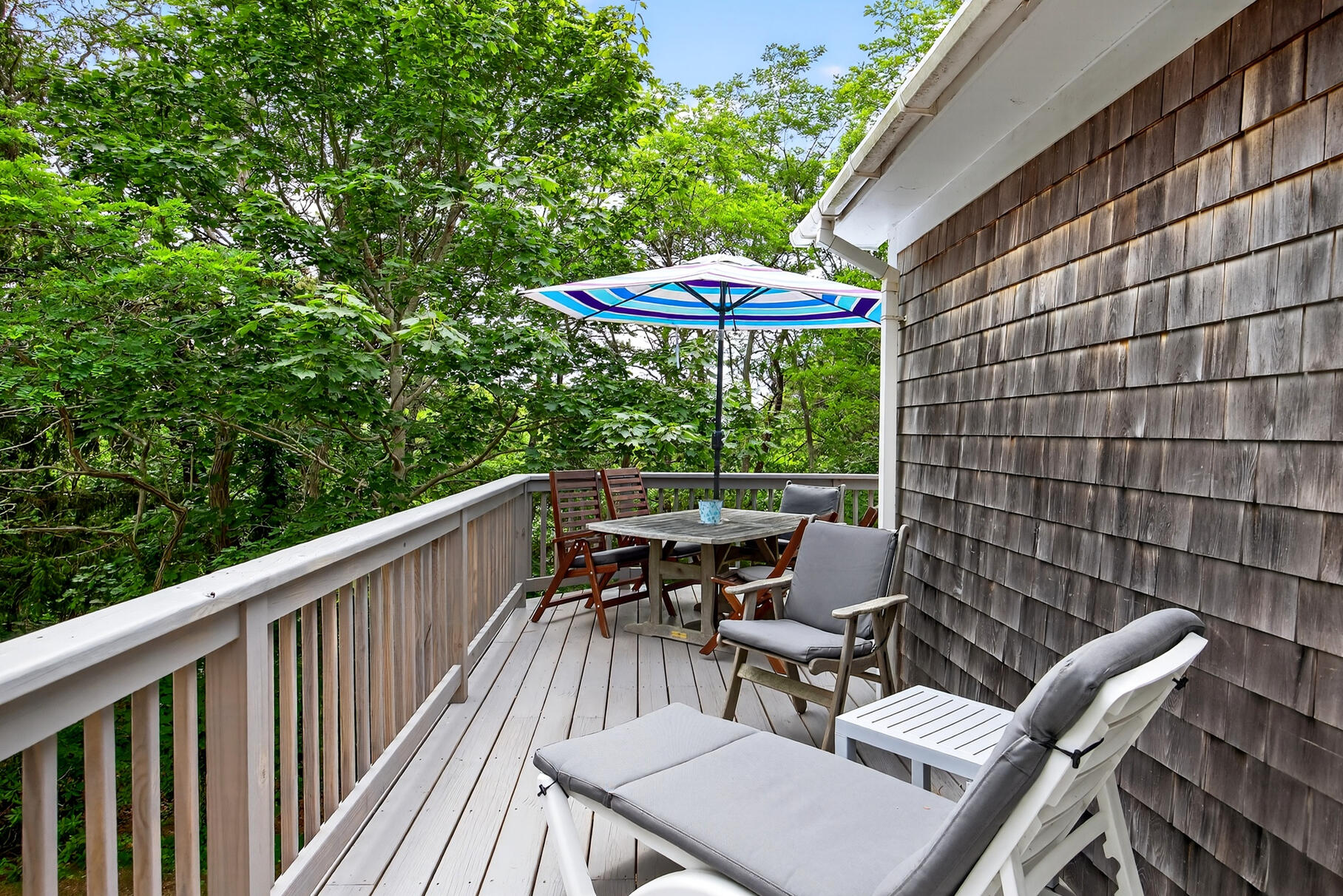 46 Hiram Hill Road Wellfleet, MA 02667 - Photo 29 of 36 a view of a patio with a table chairs and a potted plant
