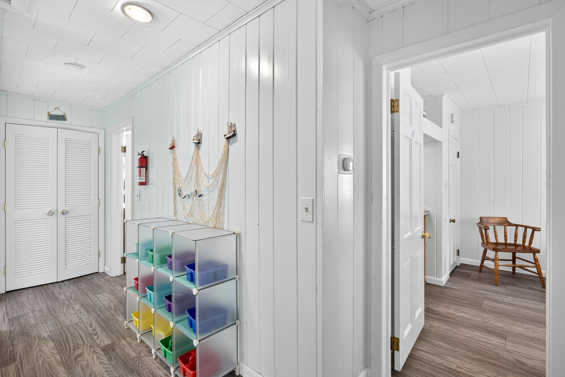 46 Hiram Hill Road Wellfleet, MA 02667 - Photo 31 of 36 wooden floor in an empty room and a mirror