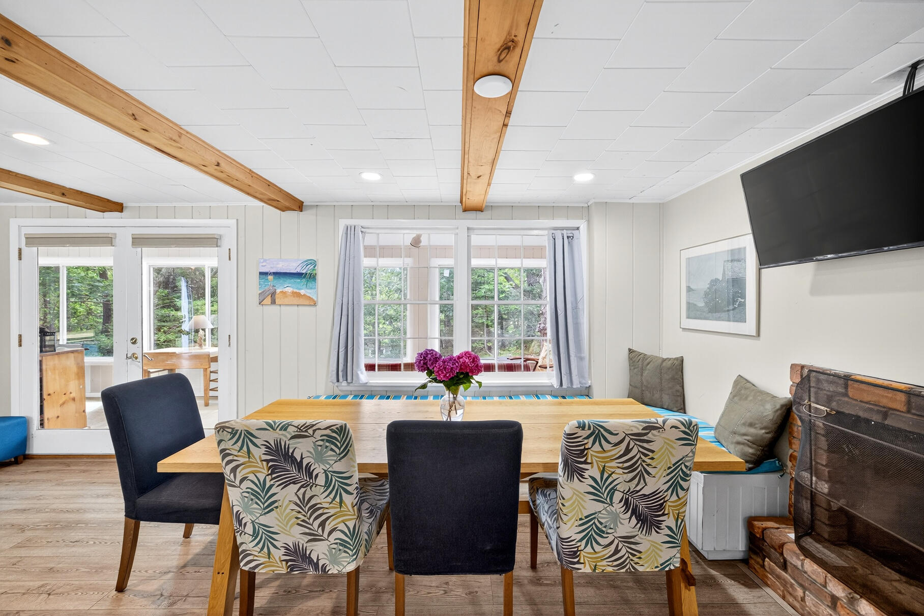 46 Hiram Hill Road Wellfleet, MA 02667 - Photo 4 of 36 a living room with furniture a flat screen tv and large windows