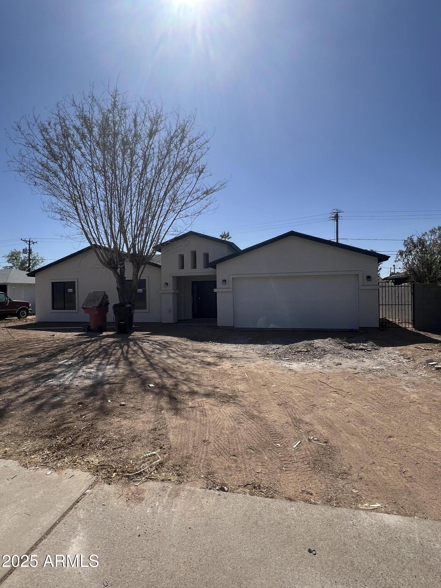 8319 East Camelback Road Scottsdale, AZ 85251 - Photo 1 of 1 a view of a house with a yard