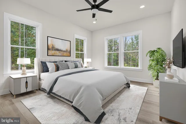 a spacious bathroom with a granite countertop sink mirror and shower