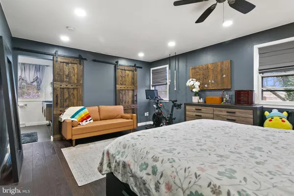 a bedroom with a bed and a couch