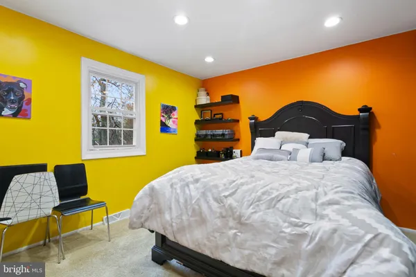 a bedroom with furniture and gym equipment