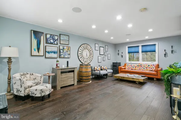a bedroom with furniture and a large window