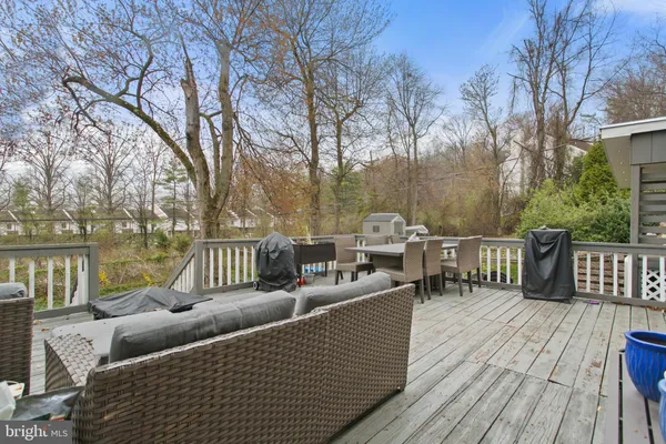 a view of backyard of house with green space