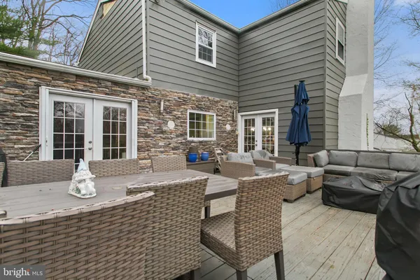 a front view of a house with outdoor seating