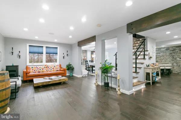 a bedroom with furniture and wooden floor