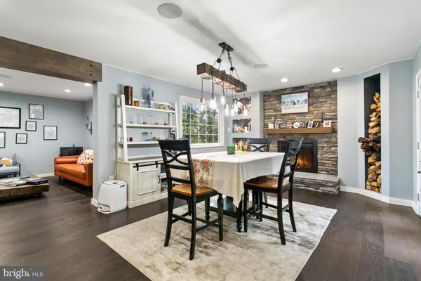 a dining room with furniture and wooden floor