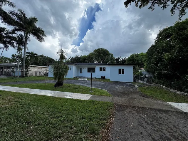 a house view with a garden space