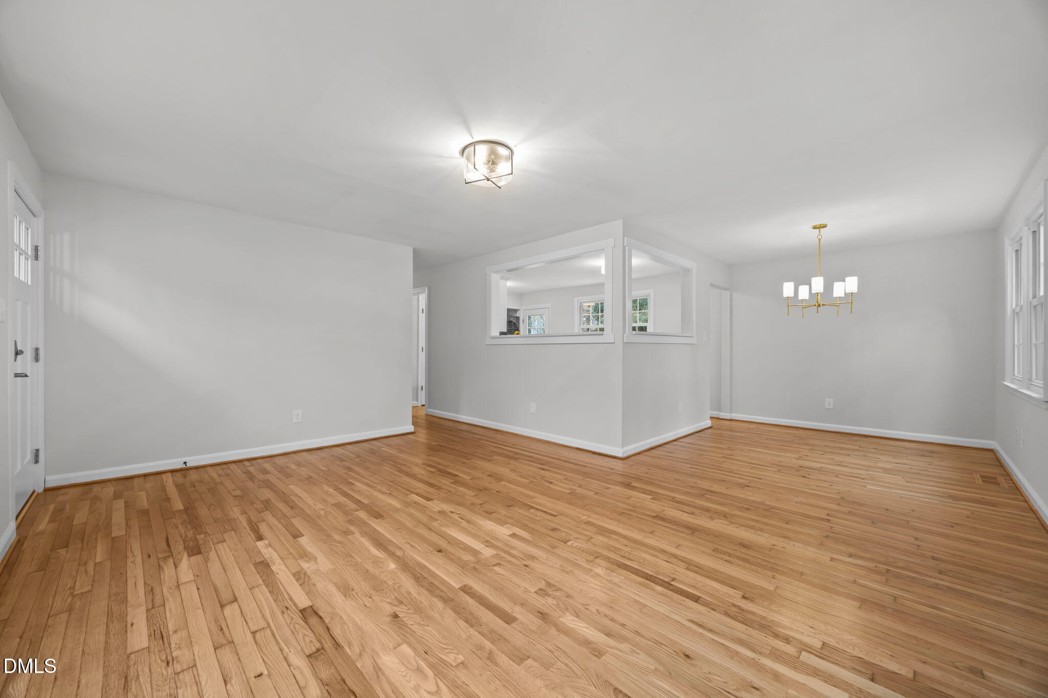 2239 Rumson Road Raleigh, NC 27610 - Photo 10 of 39 a view of empty room with wooden floor