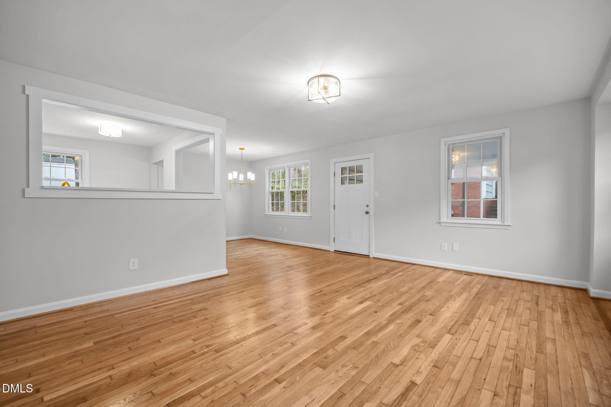 2239 Rumson Road Raleigh, NC 27610 - Photo 11 of 39 a view of empty room with wooden floor and fan