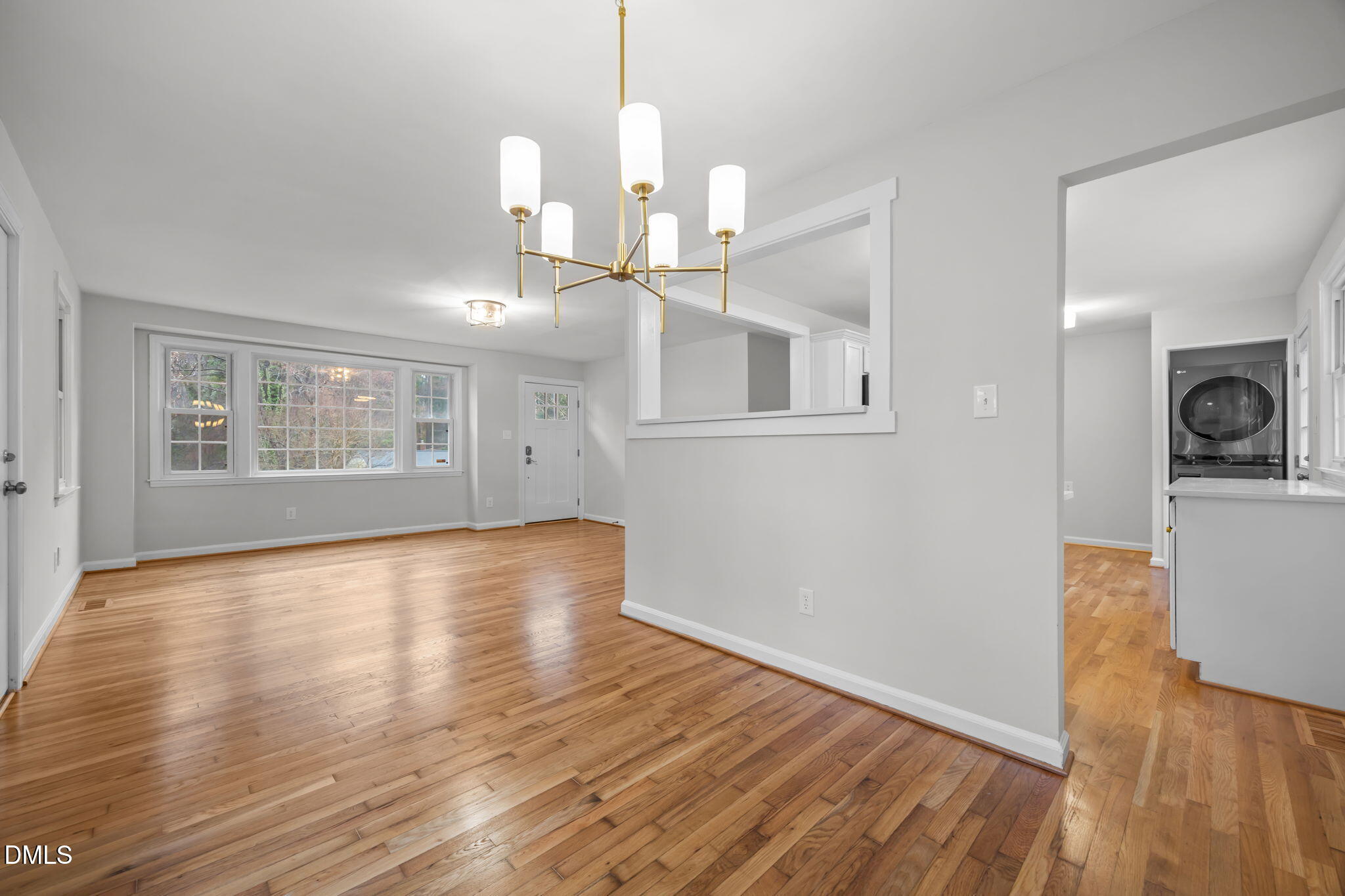 2239 Rumson Road Raleigh, NC 27610 - Photo 16 of 39 a view of empty room with wooden floor and fan