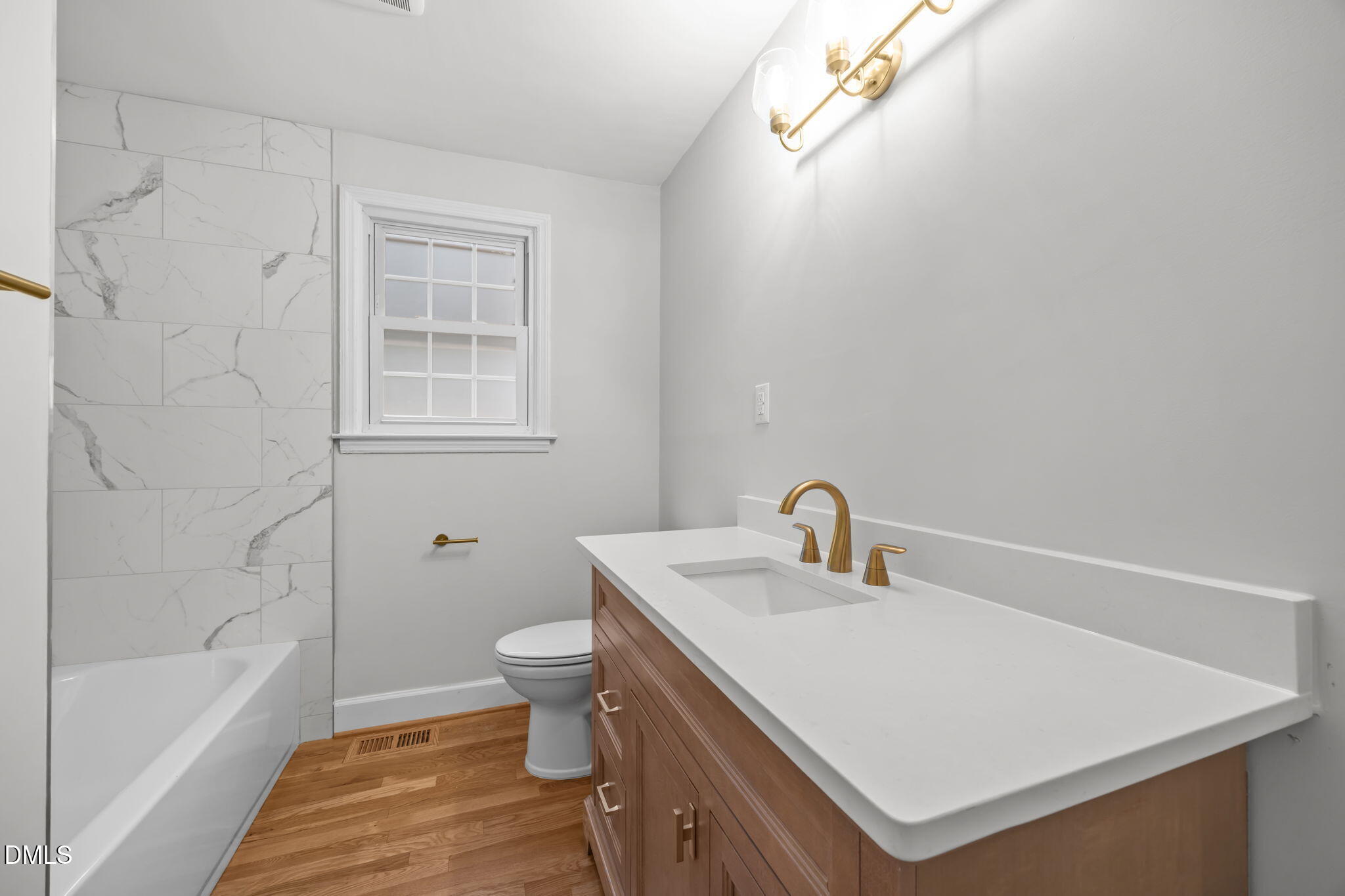 2239 Rumson Road Raleigh, NC 27610 - Photo 29 of 39 a bathroom with a sink a toilet and shower