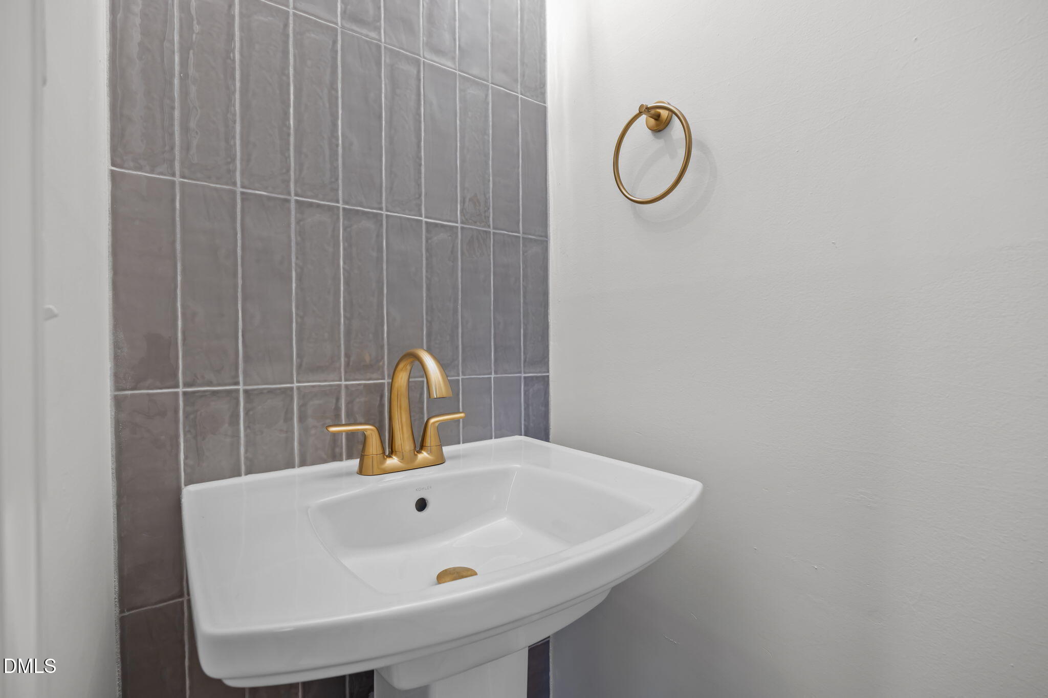 2239 Rumson Road Raleigh, NC 27610 - Photo 33 of 39 a bathroom with a sink and mirror