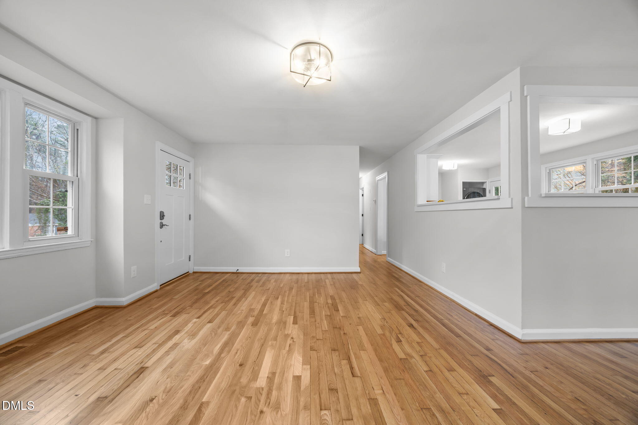 2239 Rumson Road Raleigh, NC 27610 - Photo 34 of 39 a view of empty room with wooden floor