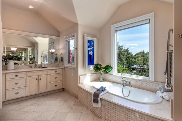 a living room with granite countertop furniture and a large window