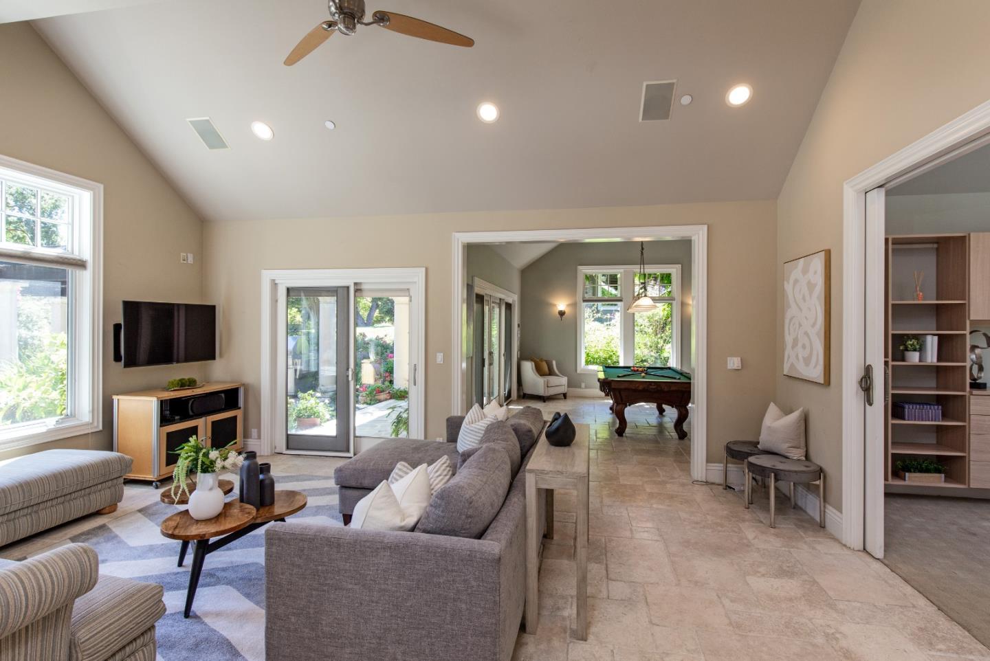 240 Laning Drive Woodside, CA 94062 - Photo 29 of 35 a living room with furniture a window and a flat screen tv