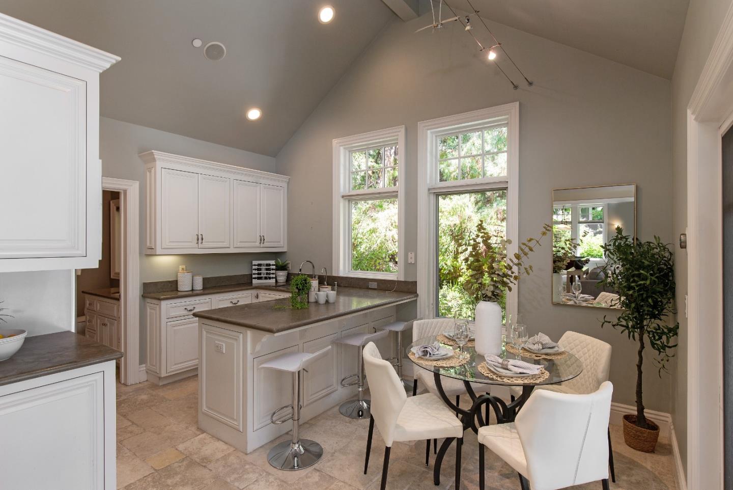 240 Laning Drive Woodside, CA 94062 - Photo 31 of 35 a kitchen with a table and chairs in it