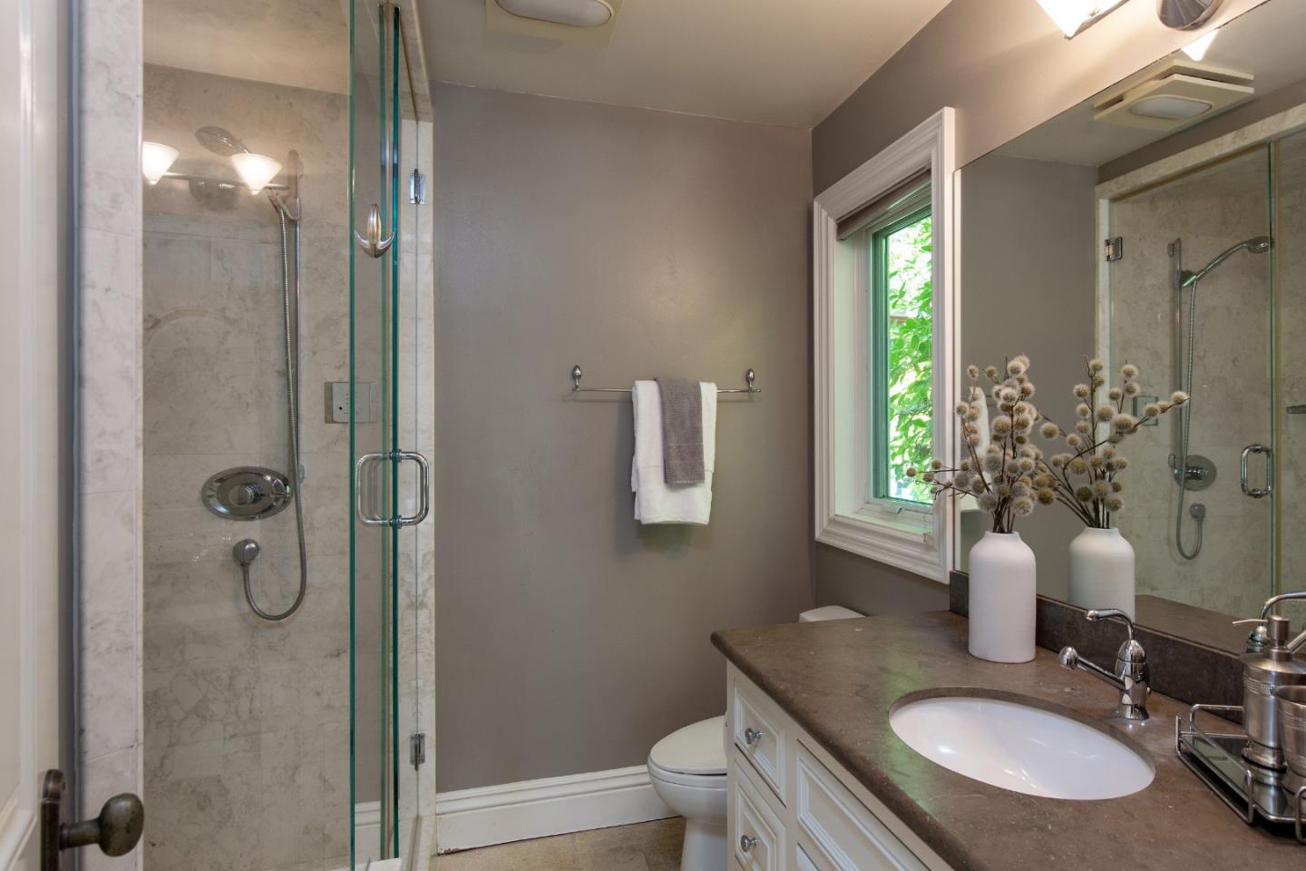 240 Laning Drive Woodside, CA 94062 - Photo 32 of 35 a bathroom with a granite countertop sink toilet and shower