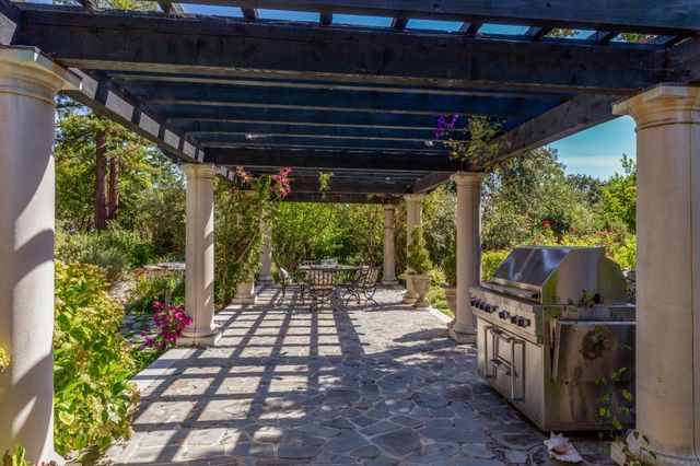 a view of a chairs and table in the patio