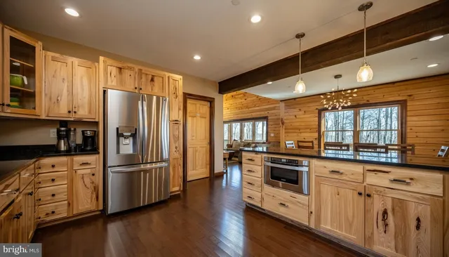 a bedroom with a bed next to a window