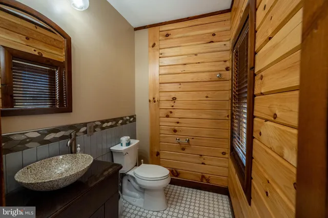 a room with furniture and kitchen view