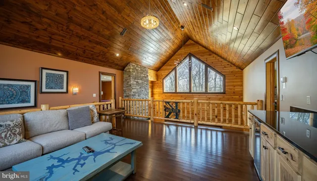 a bathroom with a granite countertop toilet sink and mirror