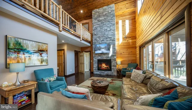 a living room with furniture or couch and a wooden floor