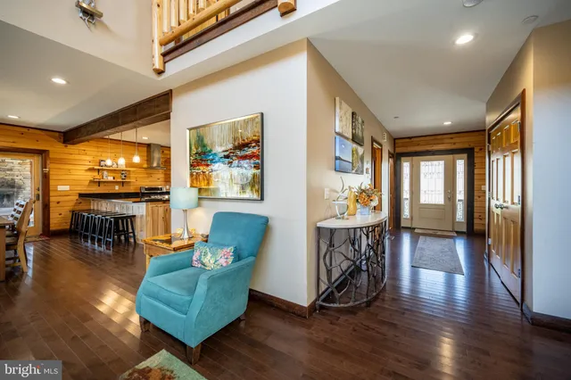a kitchen with stainless steel appliances granite countertop a stove a sink and white cabinets