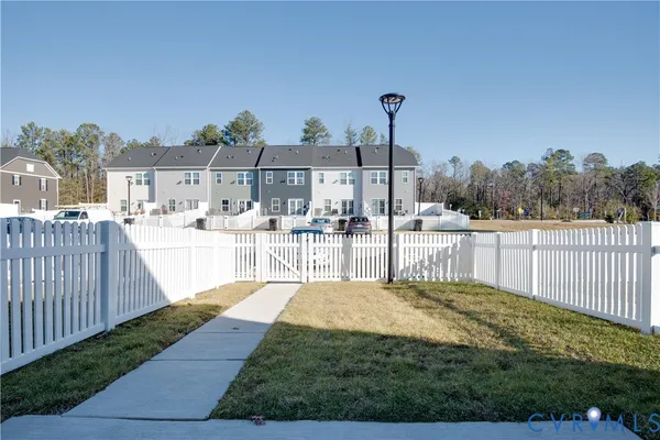 a view of a terrace with wooden fence
