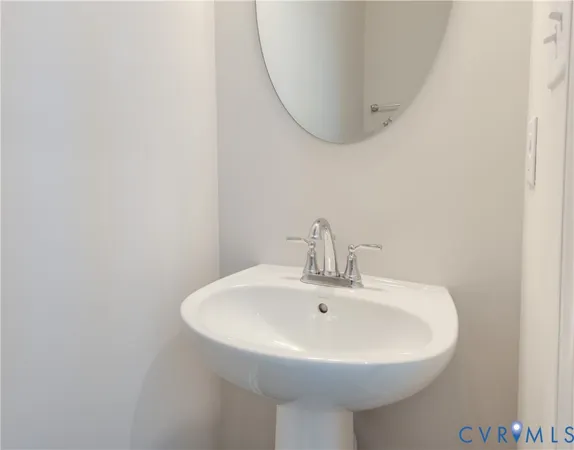 a white sink sitting next to a white sink