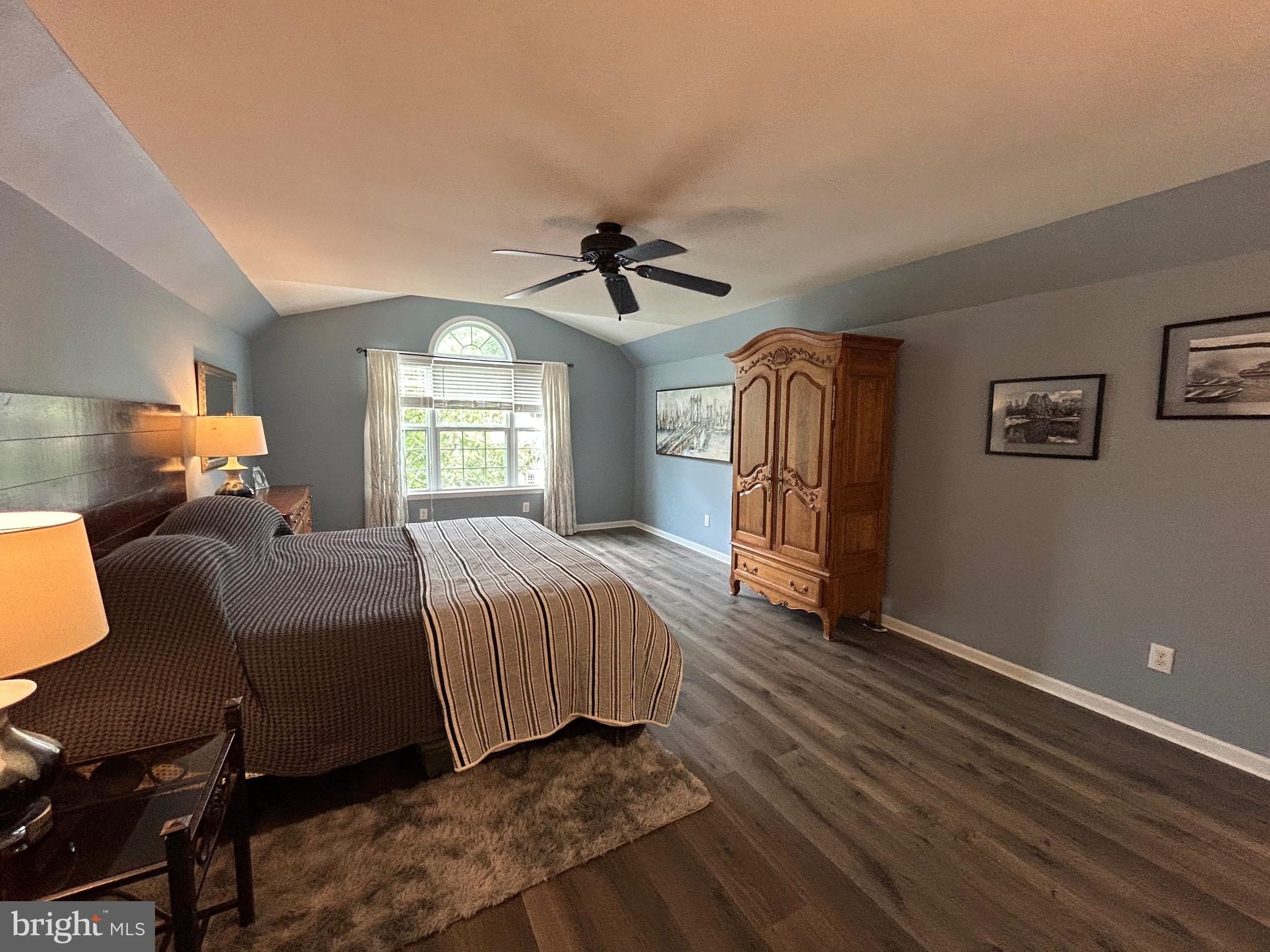 25 Baldwin Circle Glenmoore, PA 19343 - Photo 12 of 33 a spacious bedroom with a bed and a chandelier