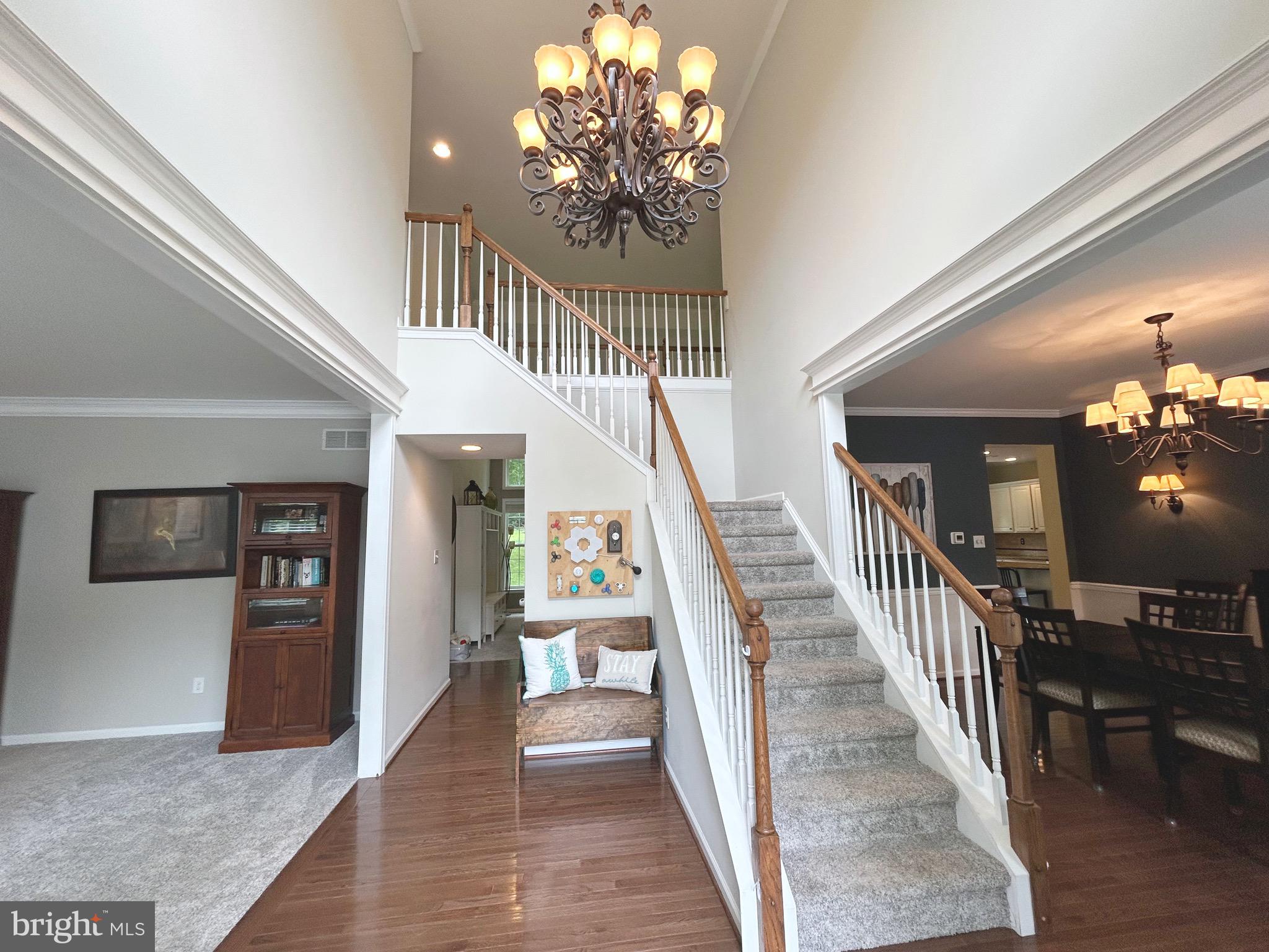 25 Baldwin Circle Glenmoore, PA 19343 - Photo 2 of 33 a view of a hallway view with wooden floor and staircase