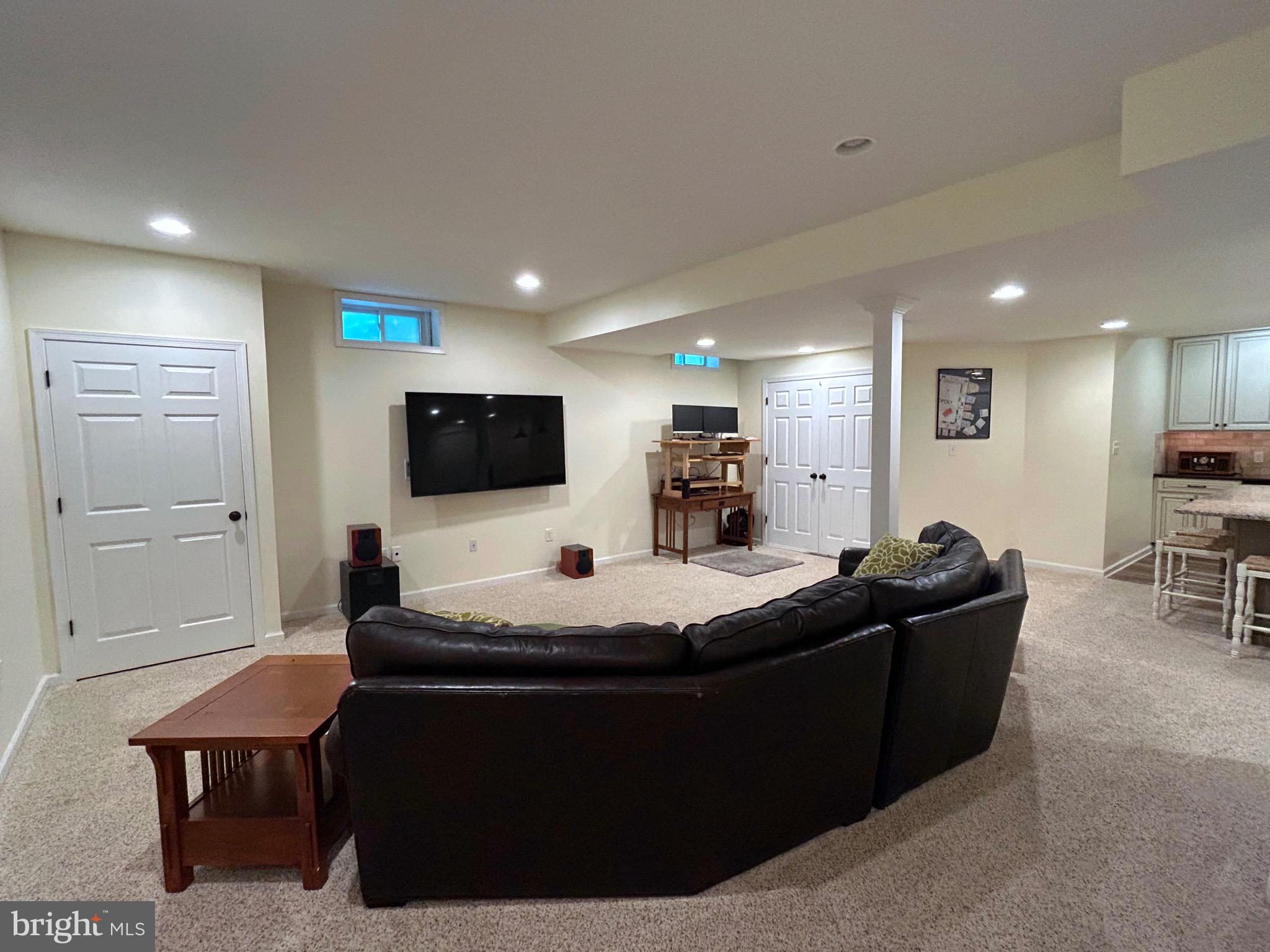 25 Baldwin Circle Glenmoore, PA 19343 - Photo 21 of 33 a living room with furniture and a flat screen tv