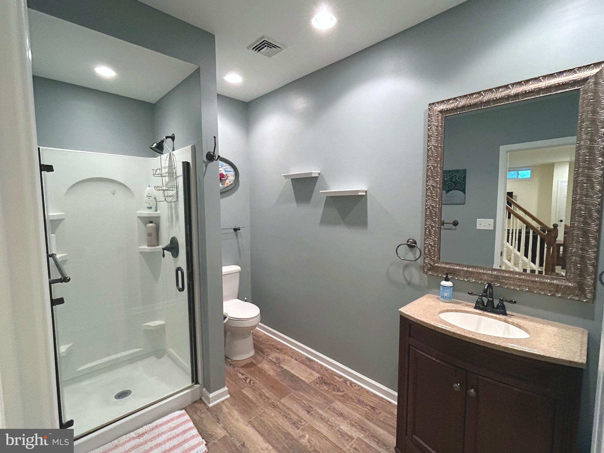 25 Baldwin Circle Glenmoore, PA 19343 - Photo 27 of 33 a bathroom with a double vanity sink mirror and shower