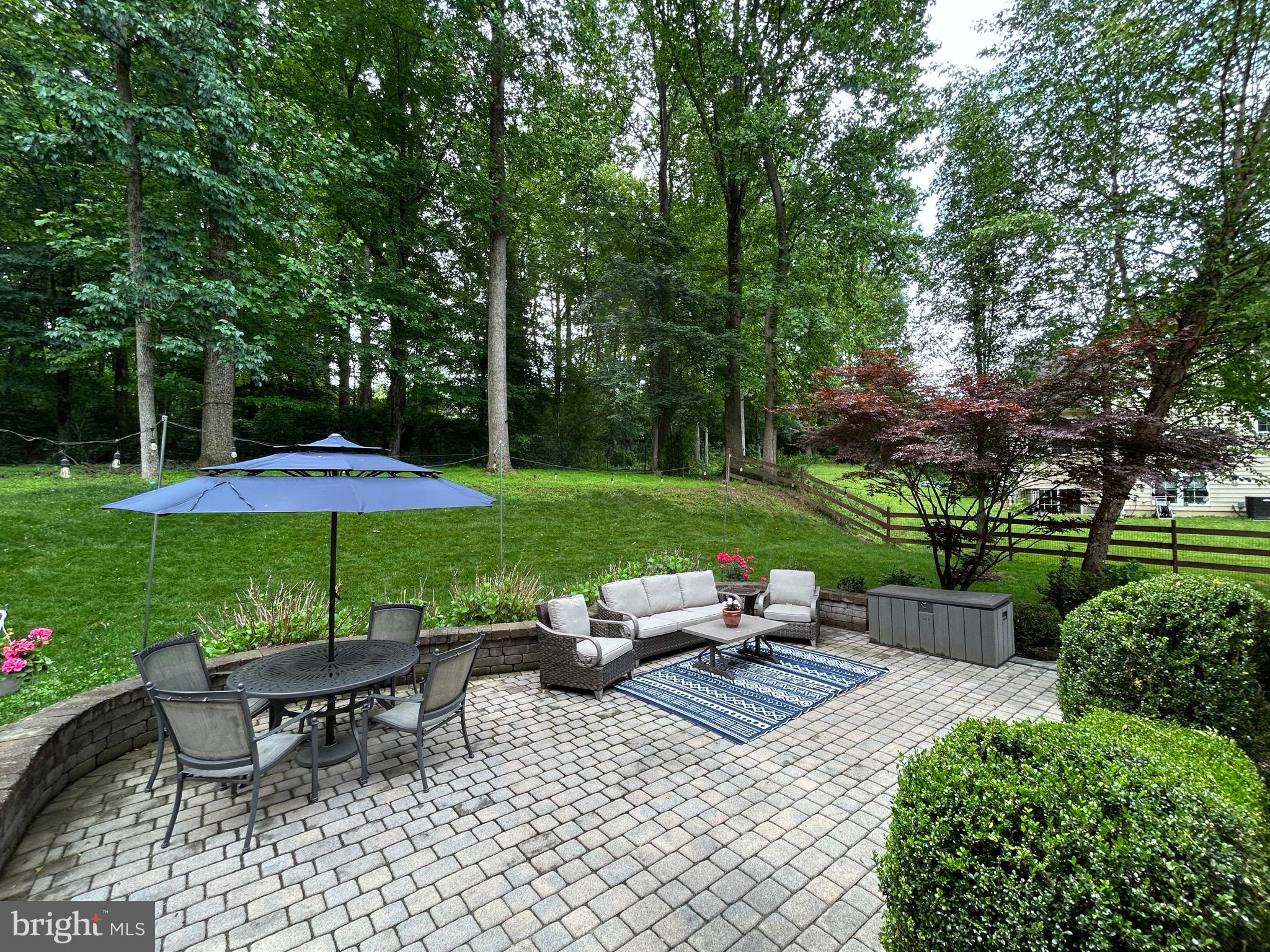 25 Baldwin Circle Glenmoore, PA 19343 - Photo 28 of 33 a view of a table and chairs under an umbrella