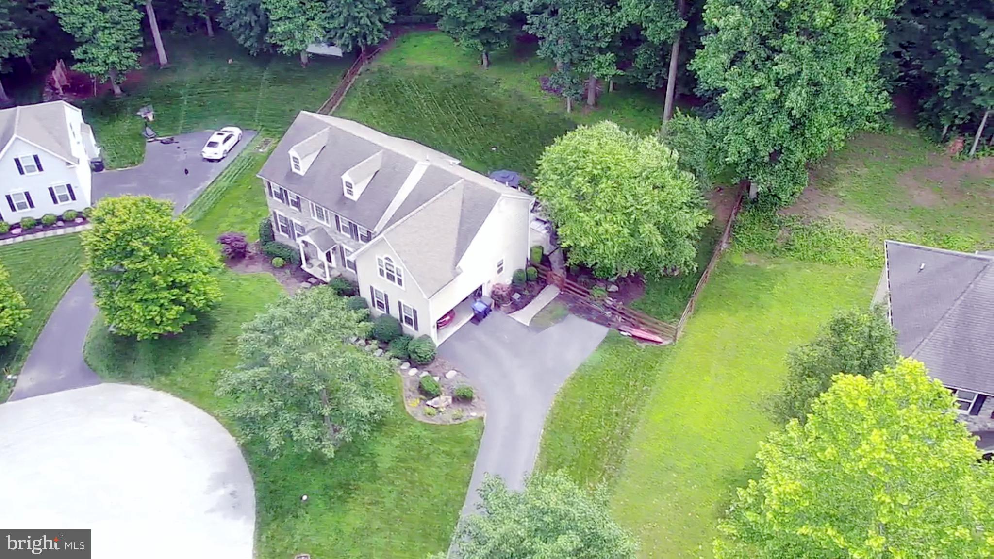 25 Baldwin Circle Glenmoore, PA 19343 - Photo 33 of 33 an aerial view of a house with garden space lake view and car parked