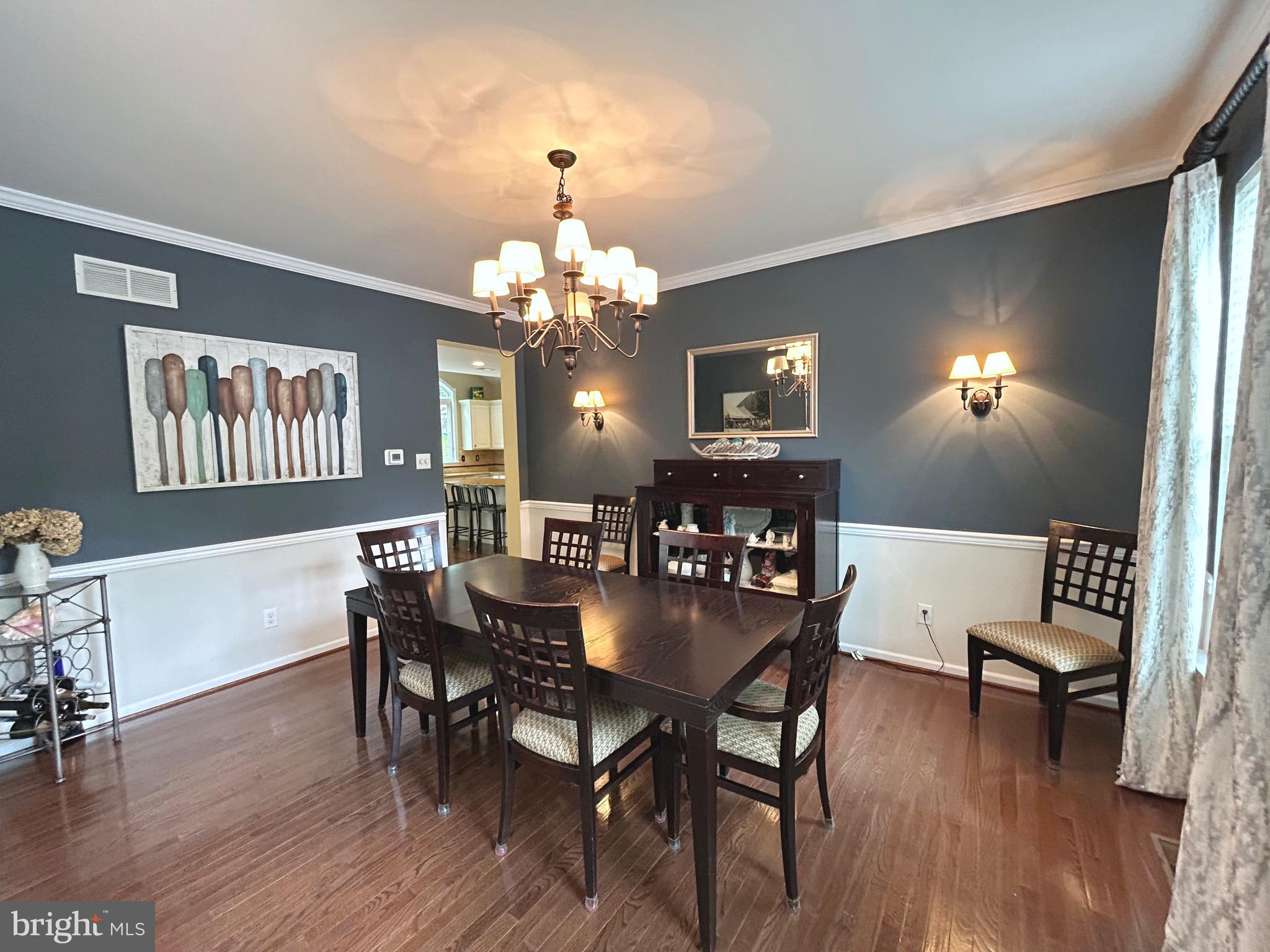 25 Baldwin Circle Glenmoore, PA 19343 - Photo 4 of 33 a view of a dining room with furniture wooden floor and chandelier