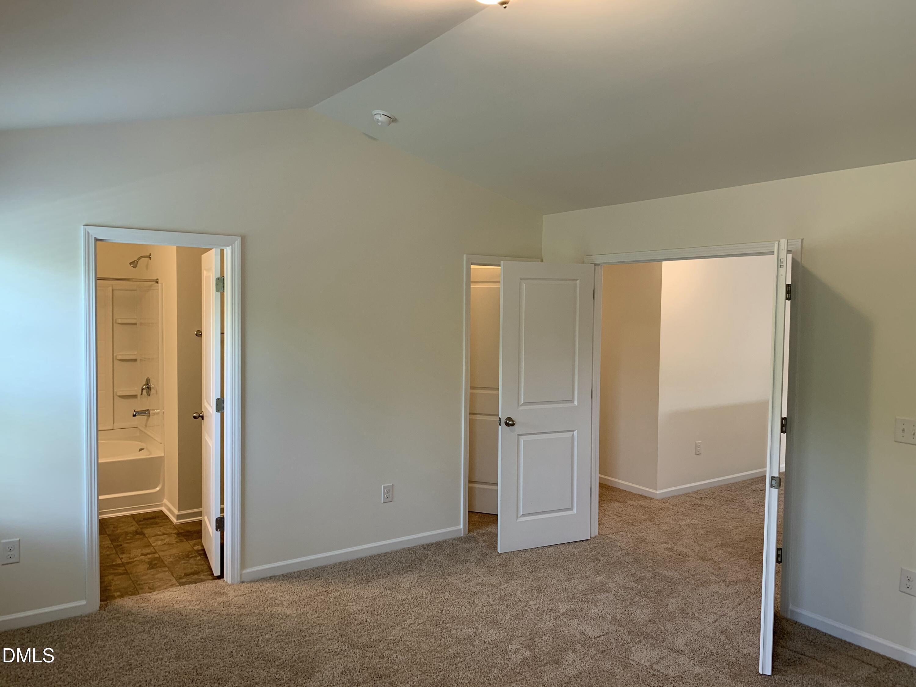 1249 Turkey Trot Road Wendell, NC 27591 - Photo 16 of 42 an empty room with closet and mirror