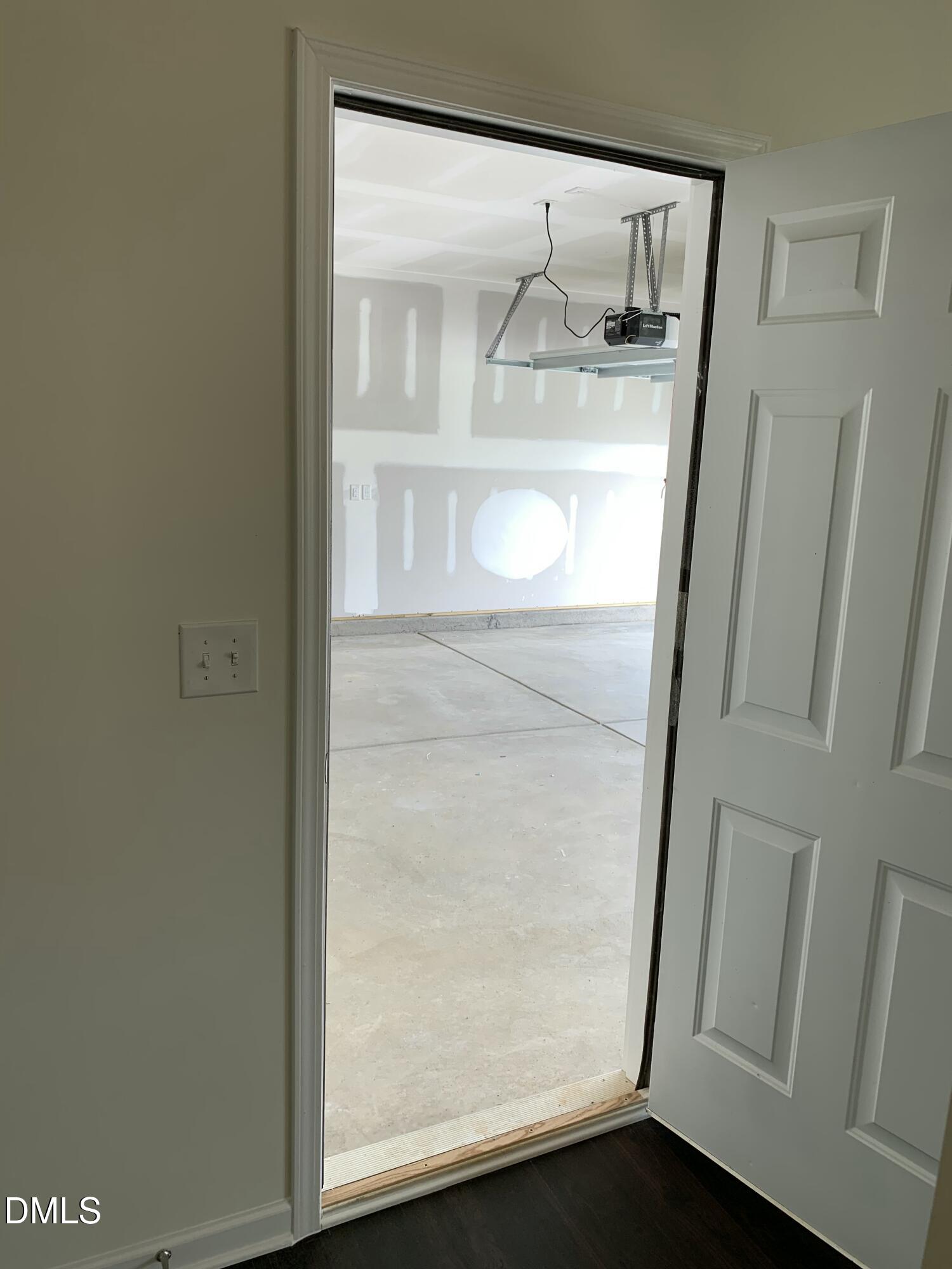 1249 Turkey Trot Road Wendell, NC 27591 - Photo 22 of 42 a bathroom with a glass shower door