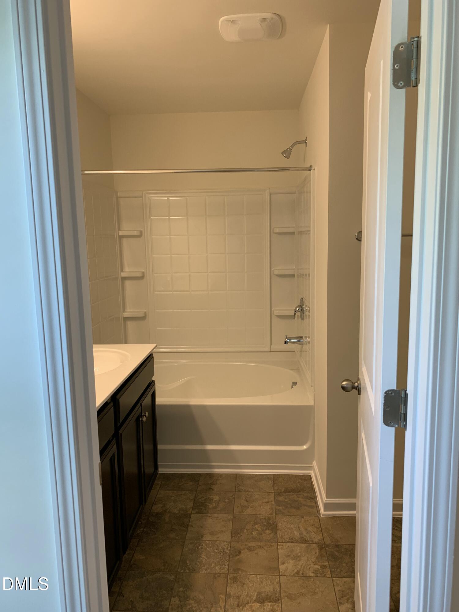 1249 Turkey Trot Road Wendell, NC 27591 - Photo 32 of 42 a bathroom with a bathtub and a shower