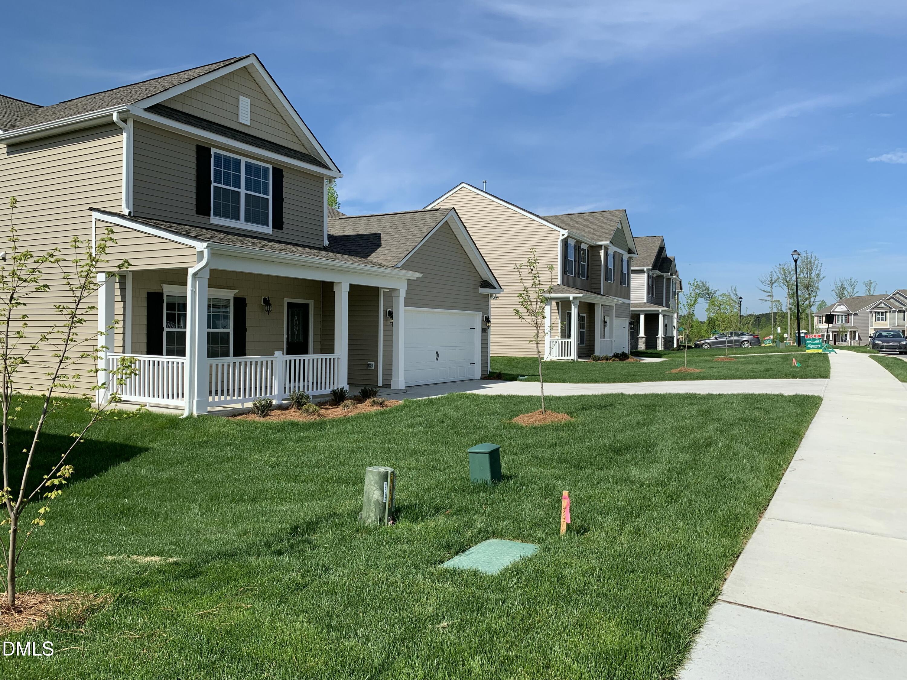 1249 Turkey Trot Road Wendell, NC 27591 - Photo 35 of 42 a front view of a house with a yard