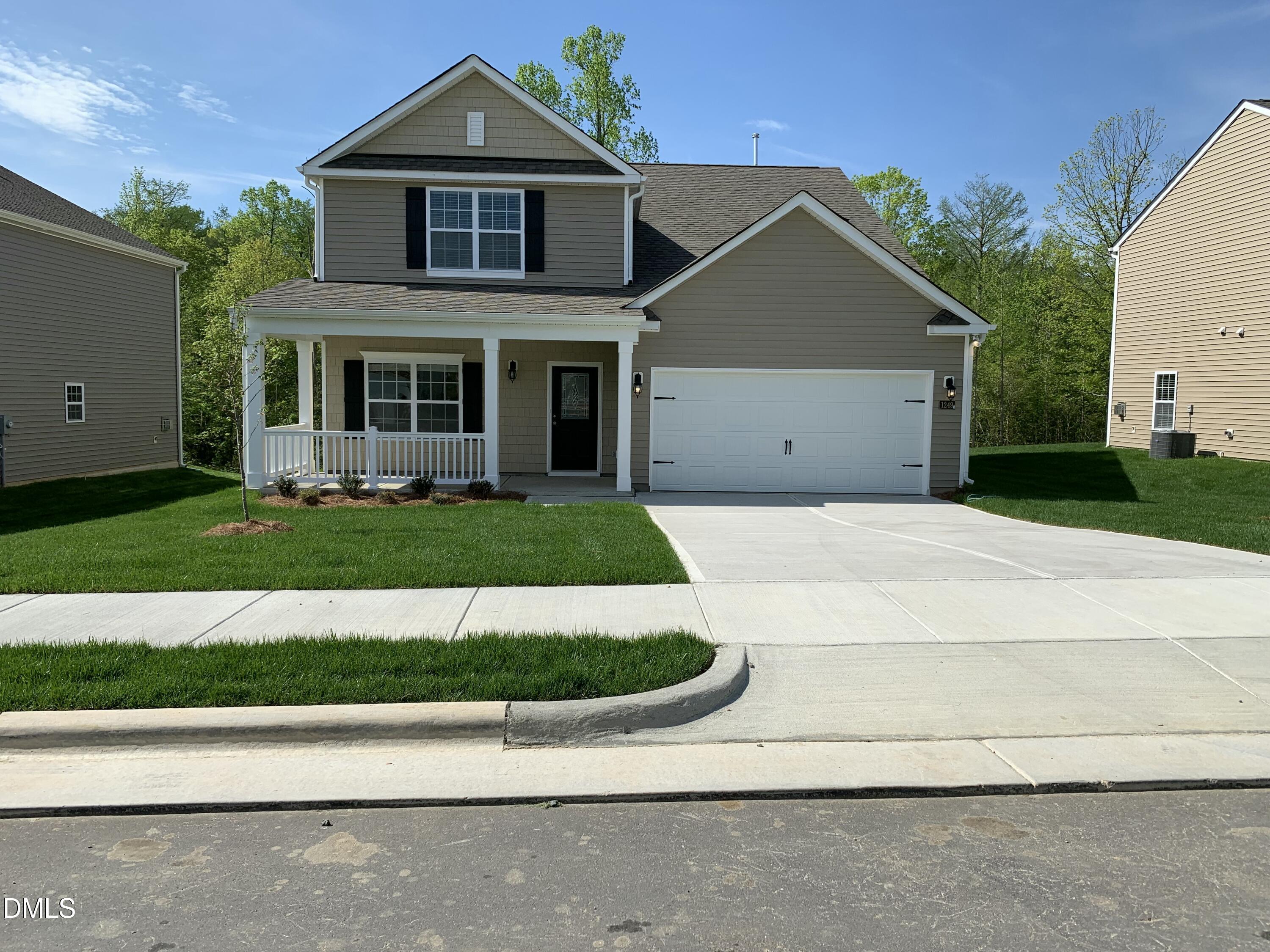 1249 Turkey Trot Road Wendell, NC 27591 - Photo 36 of 42 a front view of a house with a yard and garage