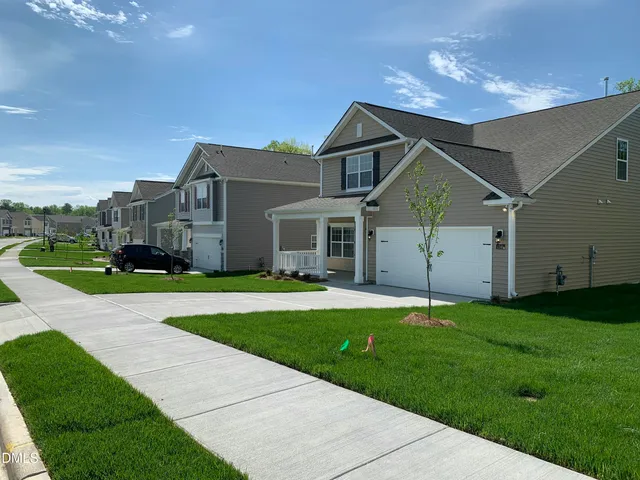 a house that is sitting in the grass