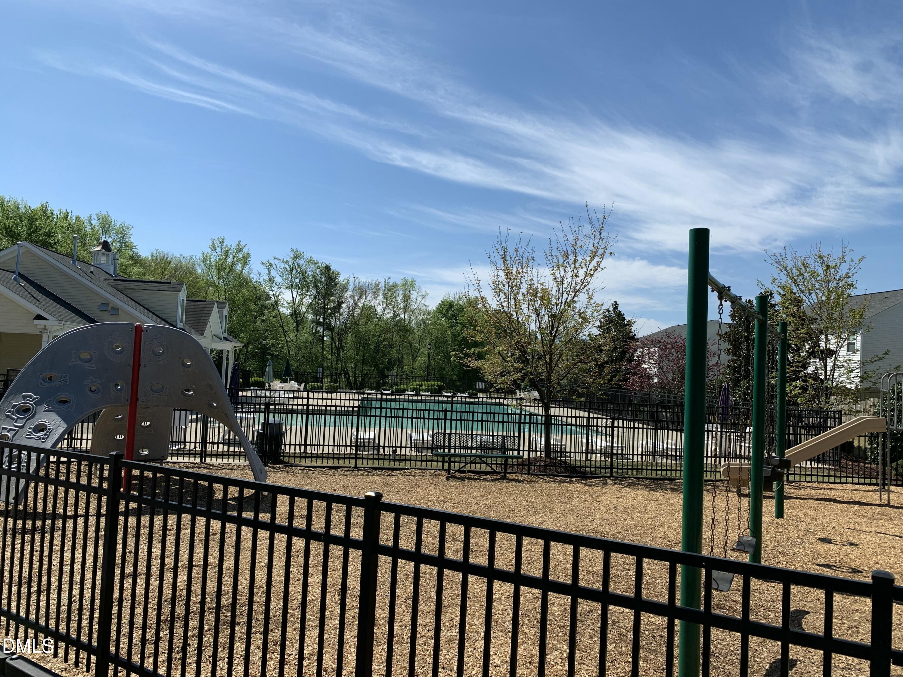 1249 Turkey Trot Road Wendell, NC 27591 - Photo 41 of 42 a view of a balcony with a floor to ceiling window and wooden fence