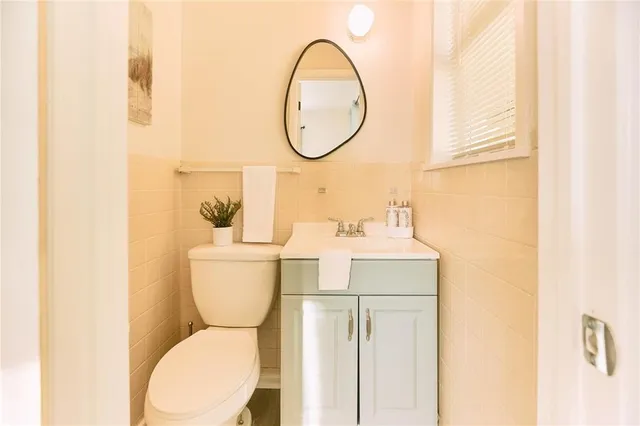 a bathroom with a toilet and a sink