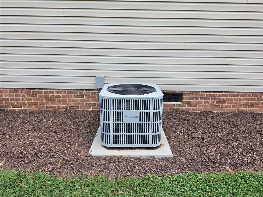 325 McAdams School Road Honea Path, SC 29654 - Photo 20 of 22 Essential cooling system with brick foundation and horizontal siding.